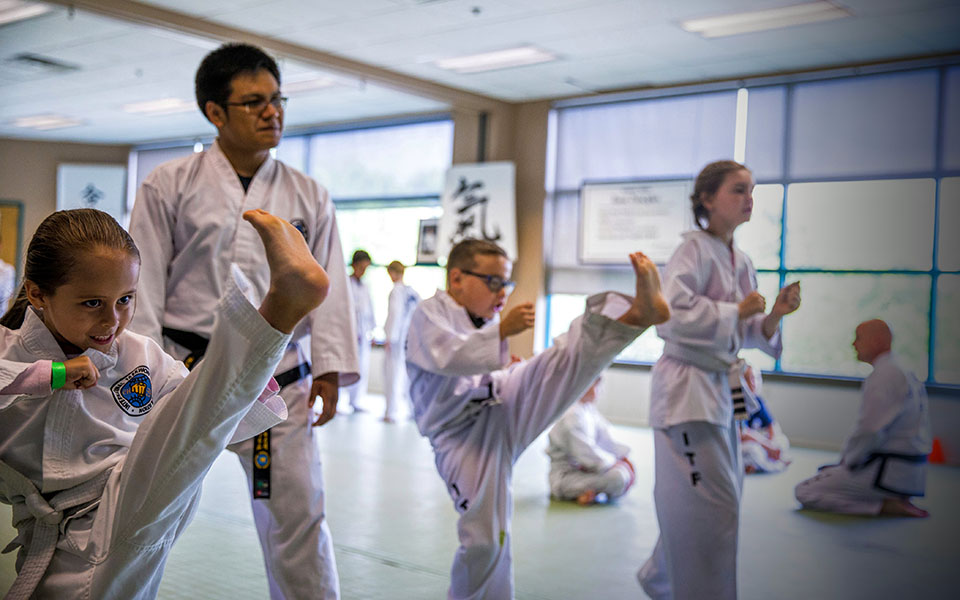Martial Arts Students in Mid-Kick